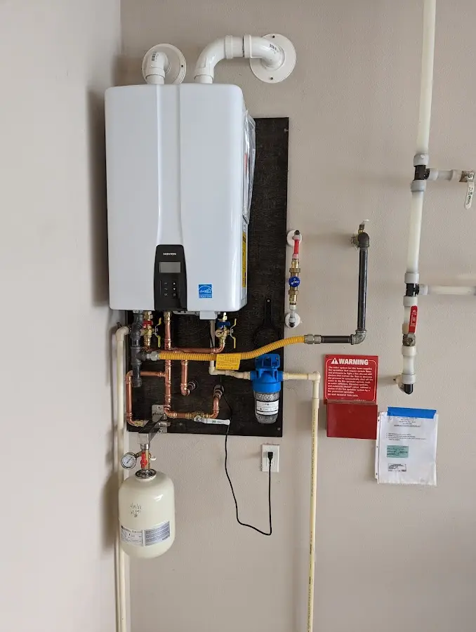 Professional plumber installing copper piping in a Hornellsville home